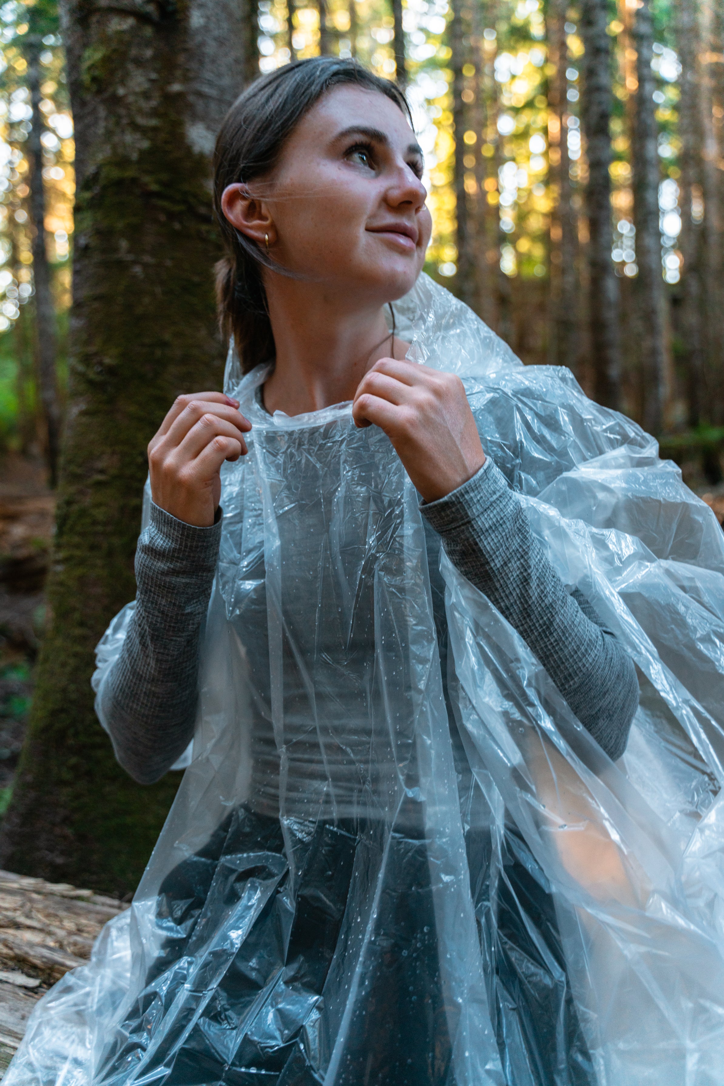 woman hiker wearing poncho